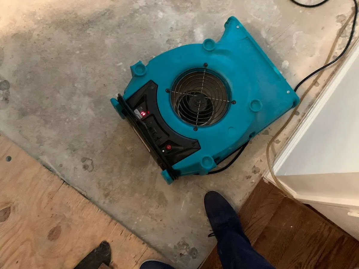 Air mover drying subfloor during Leak Detection & Repair in Carlyss